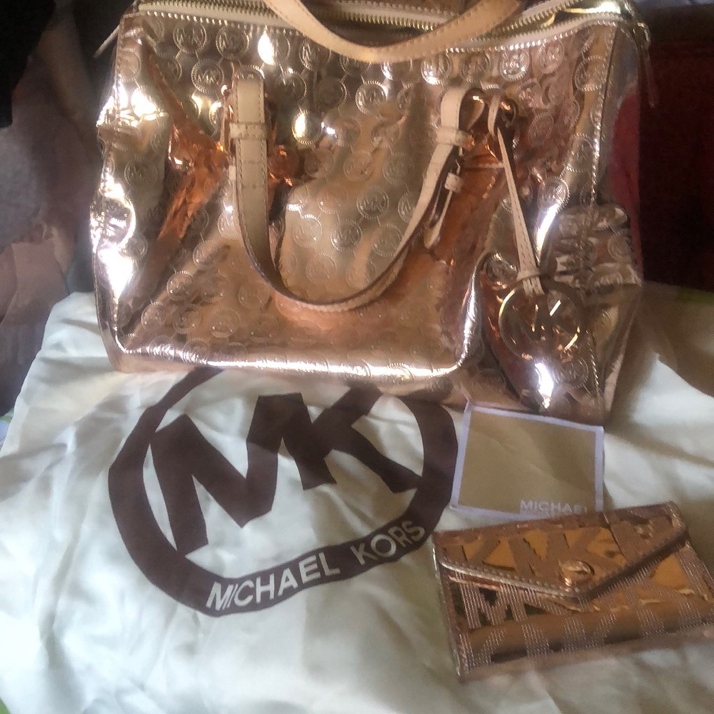 Michael Kors with matching wallet and Dust cover… new